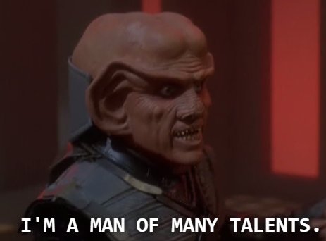 Quark wearing Klingon armor and Ferengi headdress